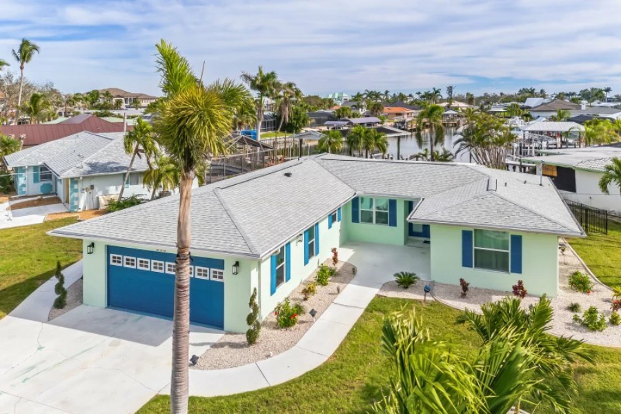 Snowbird arrival clean Fort Myers waterfront home with palm trees ready for seasonal residents
