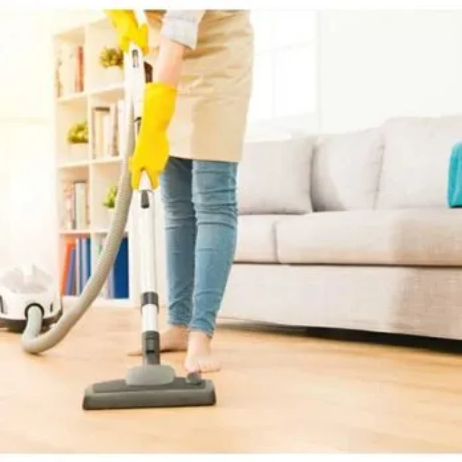 House cleaning Cypress Lake Fort Myers FL maid vacuuming living room hardwood floor