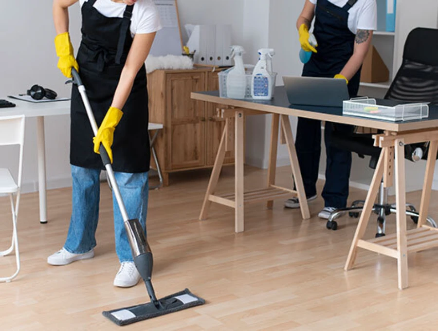 Professional house cleaning team mopping floors in McGregor Fort Myers FL | CleanService