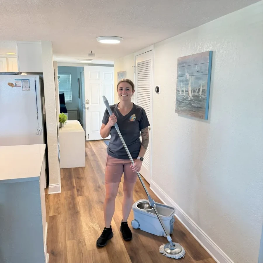House cleaning Pelican Preserve Fort Myers FL smiling cleaner with mop ready to clean home